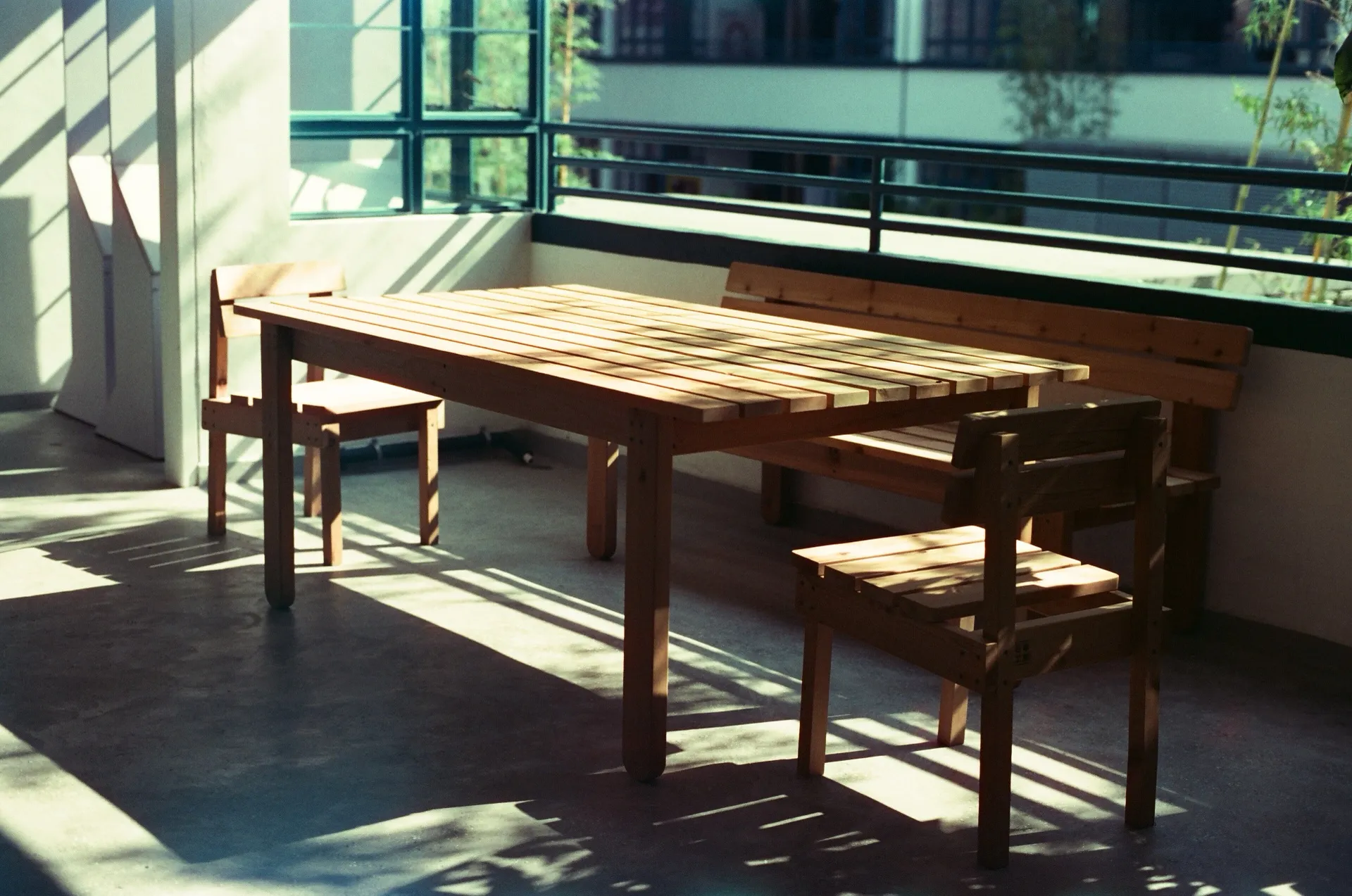 Wooden table and chairs in the sunlight